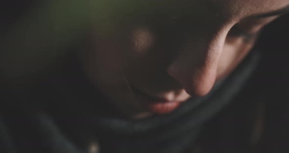 Close up of a young woman studying and writing notes