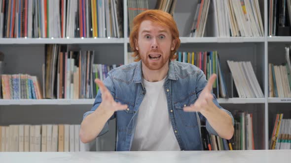 Angry Fighting Redhead Man at Work in Office