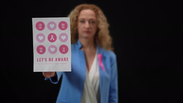 Closeup Breast Cancer Awareness Banner with Blurred Caucasian Elegant Woman at Black Background