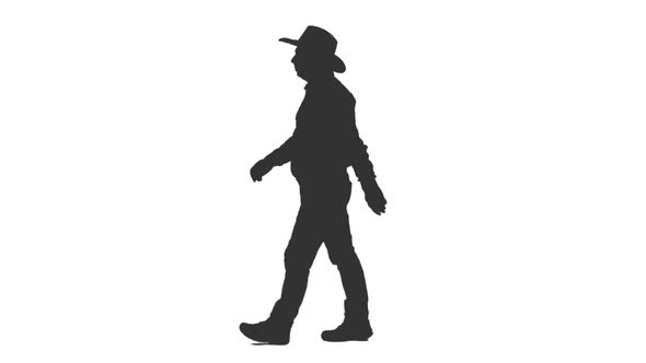 Black and White Silhouette of Adult Man Walking in Cowboy Hat