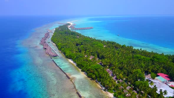 Aerial drone landscape of lagoon beach journey by blue water with sand background