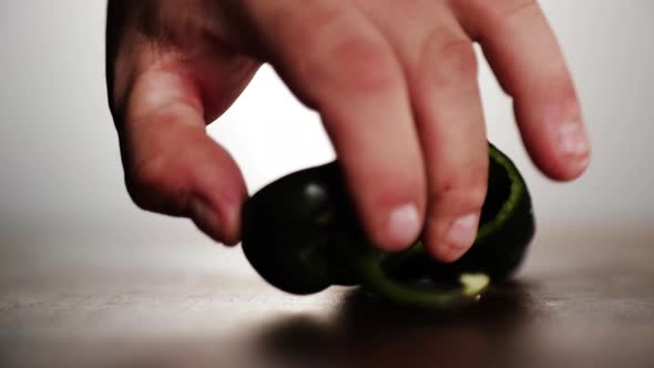 Professional chef preparing a poblano pepper.