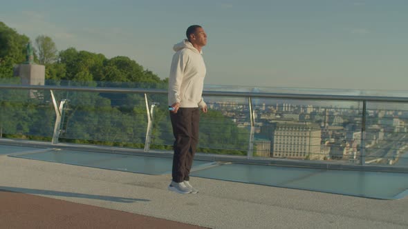 Active Sporty Fit Black Man Practicing Skipping Rope Workout Outdoors at Sunrise