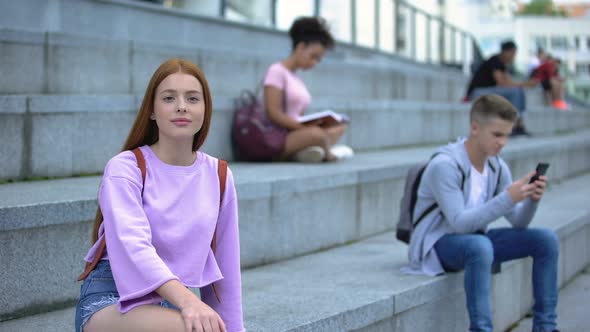 Beautiful Red-Haired Teenager Sitting Stairs Smiling Camera, Student Exchange