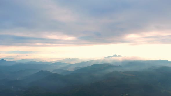 4K Aerial view of Mountains landscape with morning fog.