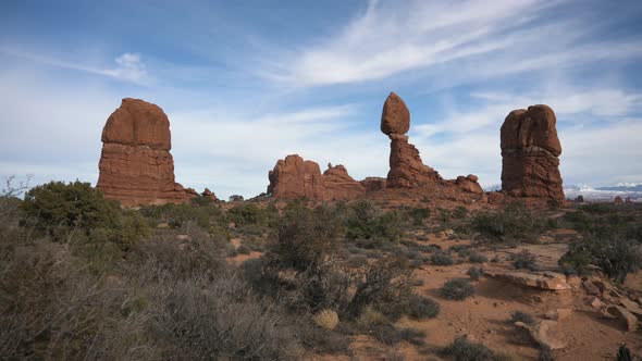 Close up view of Balance Rock on a hike in Arches National Park, pan