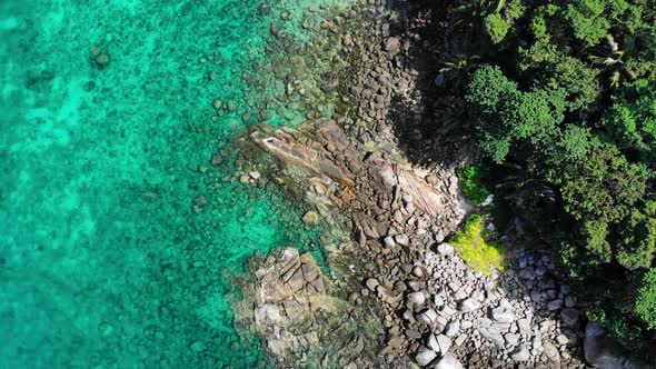 Flying Slowly Above Coral Reefs on the Shore of Uninhabited Island in the Ocean