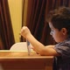 A little child touches a tablet PC at a table at home. Casual clothes - VideoHive Item for Sale