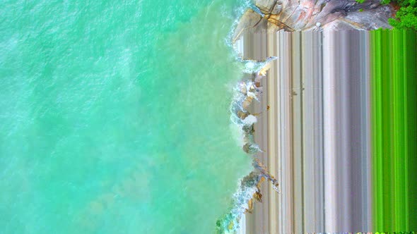 An aerial view from a drone flying over beautiful beaches and rocks