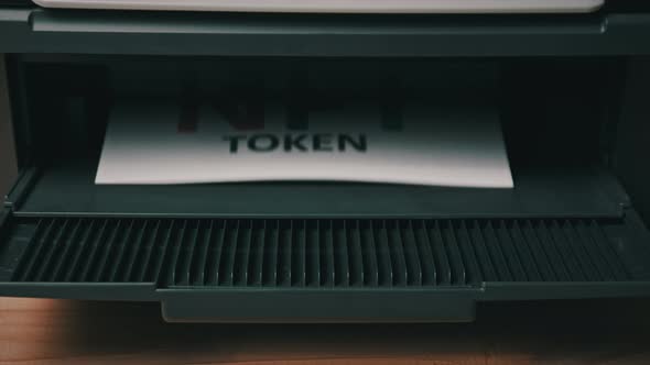 NFT Token Printing Inscription on White Sheet of Paper Printed By a Jet Printer