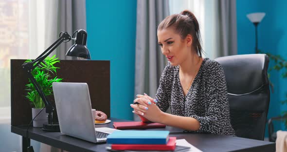 A Upset College Student Girl is Video Chatting on a Laptop