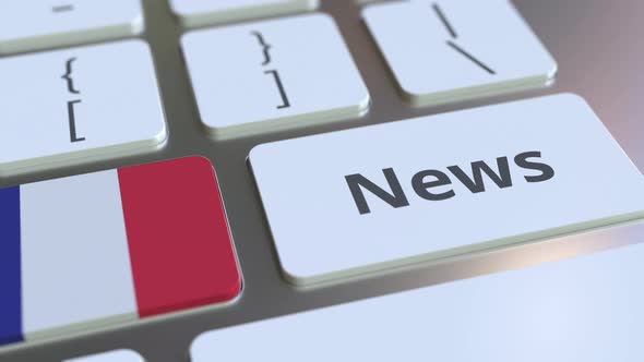 News Text and Flag of France on the Keys of a Keyboard alt