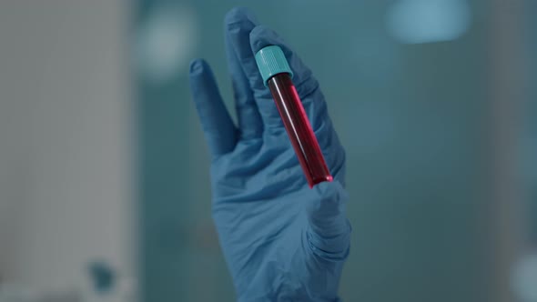 Scientist Holding Test Tube with Dna Substance in Laboratory