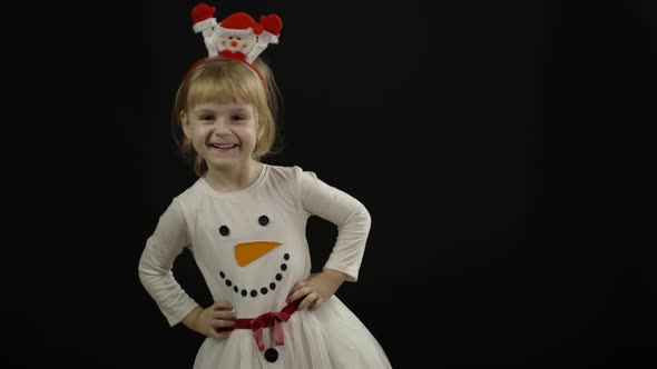 Happy Beautiful Baby Girl in Snowman Costume. Christmas. Make Faces, Dance