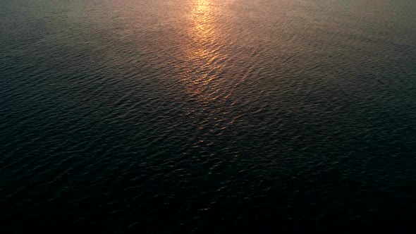 Aerial Wiev of Rippled Water Surface of Sea on Sunset