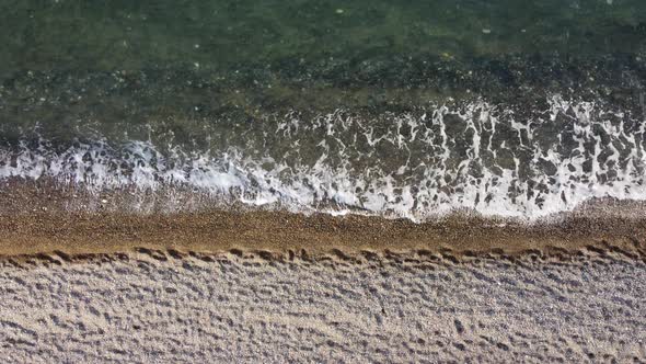 Aerial View From Above on Azure Sea and Pebbles Beach