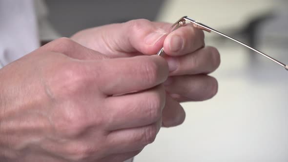 An Optometrist Makes Glasses in Laboratory