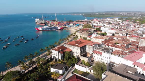 Aerial Waterfront and Seaport of Stone Town Anchored Boats in Ocean Zanzibar