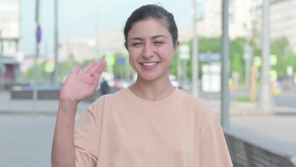 Portrait of Indian Woman Waving Welcoming