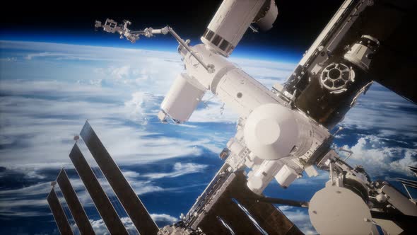International Space Station in Outer Space Over the Planet Earth alt
