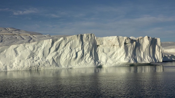 Arctic sailing among glaciers and floating ice blocks, in frozen sea and breathtaking landscape