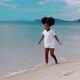 Happy African American girl enjoy and walking on the beach - VideoHive Item for Sale