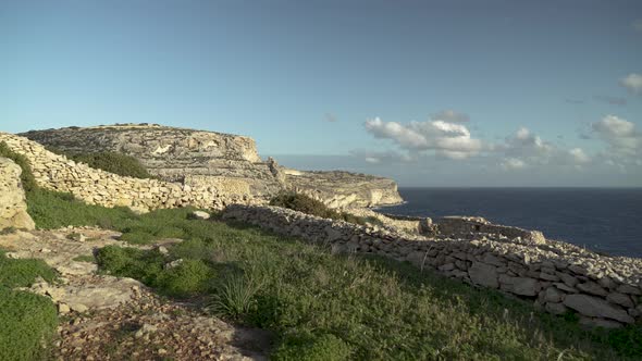 Walking on Farmers Land on the Top of Blue Grotto on a Golden Hour Evening in Malta