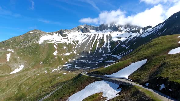 Aerial shot of Nufenenpass and surrounding mountains in the Swiss Alps