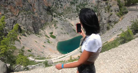 Young Female Tourist Enjoy Walking Makes Shooting on Mobile Phone During Travel