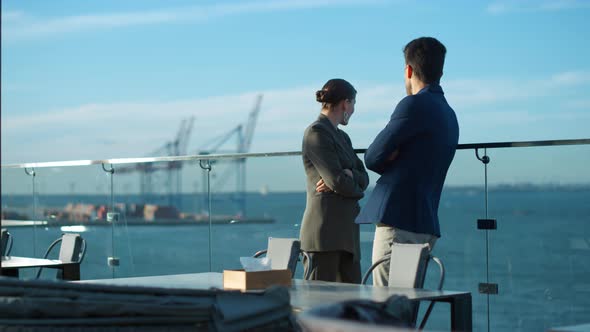 Couple Looking Sea Terrace in Morning Sunlight