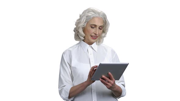 Mature Business Woman Using Digital Tablet