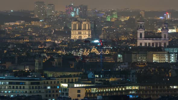 Aerial Panorama Above Houses Rooftops in a Paris Night Timelapse