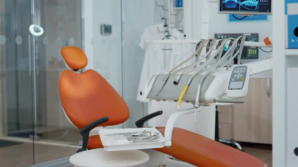 Close Up of Dental Chiar in Empty Dentist Stomatology Hospital Office with Nobody in It