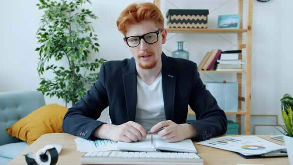 Young Entrepreneur Talking During Online Video Call Wearing Formal Clothing at Home