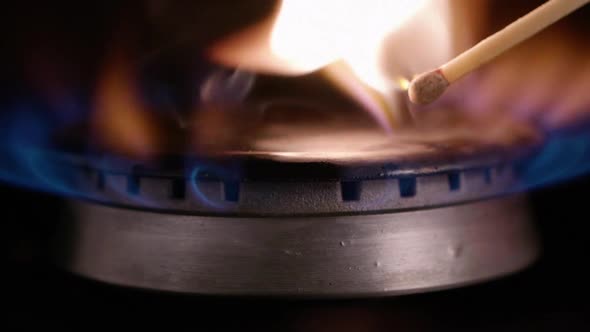 HD - Match ignites gas stove. slow motion