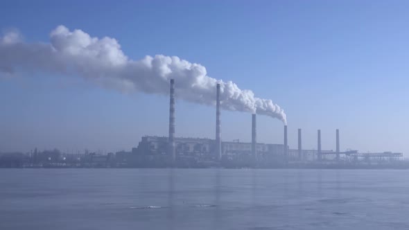 Smoke From the Chimneys Plant Rises Into the Clouds 005