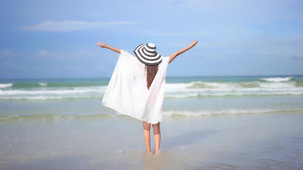 Asian woman enjoy around beautiful beach sea ocean