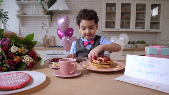 Loving Mixed Race Son Preparing Holiday Breakfast