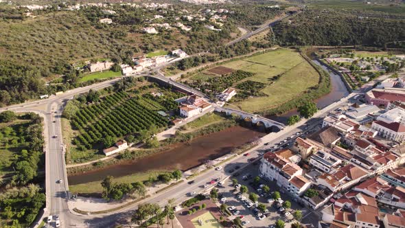 Rotating aerial pan over the Arade river in Silves, Portugal