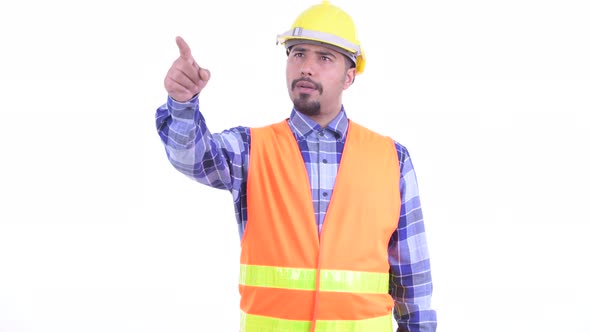 Happy Bearded Persian Man Construction Worker Directing and Pointing Finger