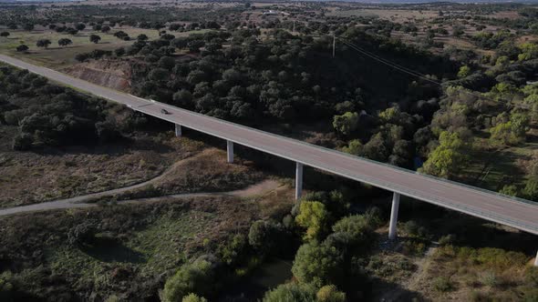 Modern bridge at Vila Formosa in Portugal. Aerial rising tilt down