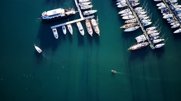 View from drone on full of yachts Bodrum harbour and ancient Kalesi castle in Mugla in Turkey