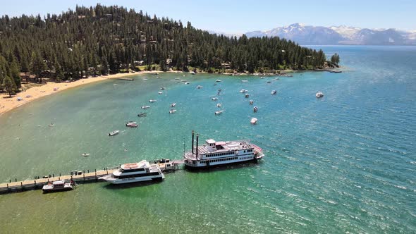 MS Dixie ll ferry boat on the dock as a drone flies counter clockwise with Desolation Wilderness and