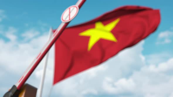 Closing Boom Barrier with Stop Immigration Sign at Flag of Vietnam alt
