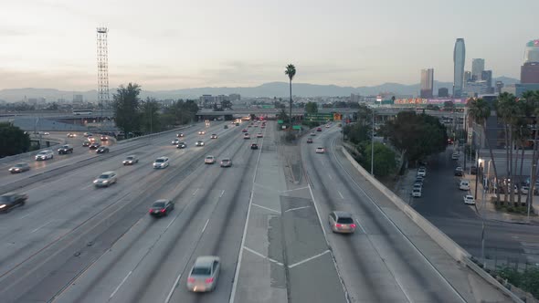 Aerial View Over the Roadbed of Los Angeles Downtown, Busy with Rush Traffic in All Directions