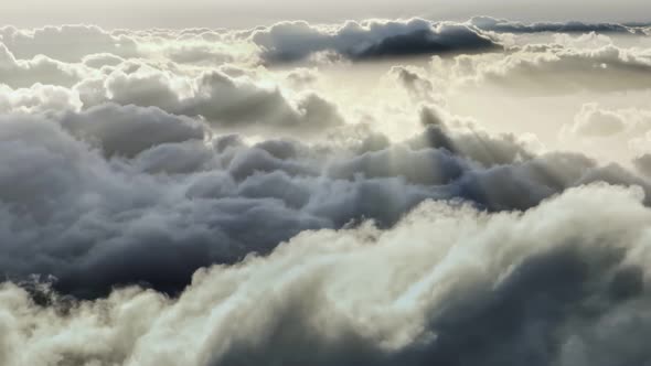 Rays of Dawn Sun Illuminate White Cirrus Clouds