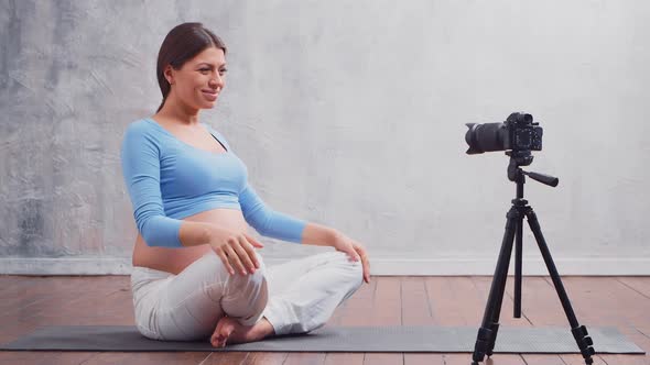 Young pregnant woman is resting at home and expecting a baby.