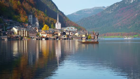 Autumn Colors in Famous Tourist Destination Idillyc Town Hallstatt in Mountains Alps. Cathedral