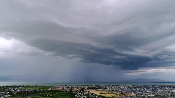 Aerial view of wall cloud moving over Utah Lake as storm follows