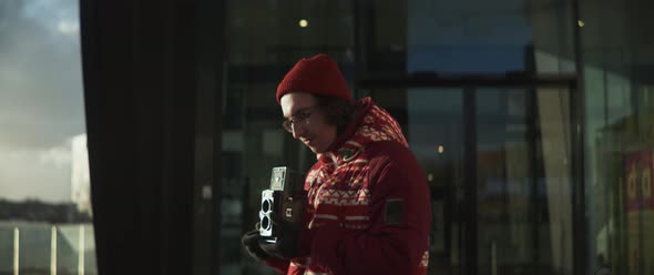 Man using vintage camera preparing to take pictures